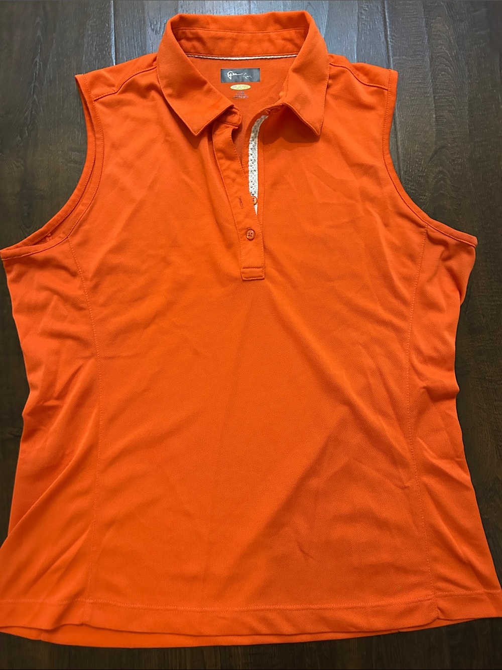 Greg Norman Collection Ladies Sleeveless Polo in Bright Orange